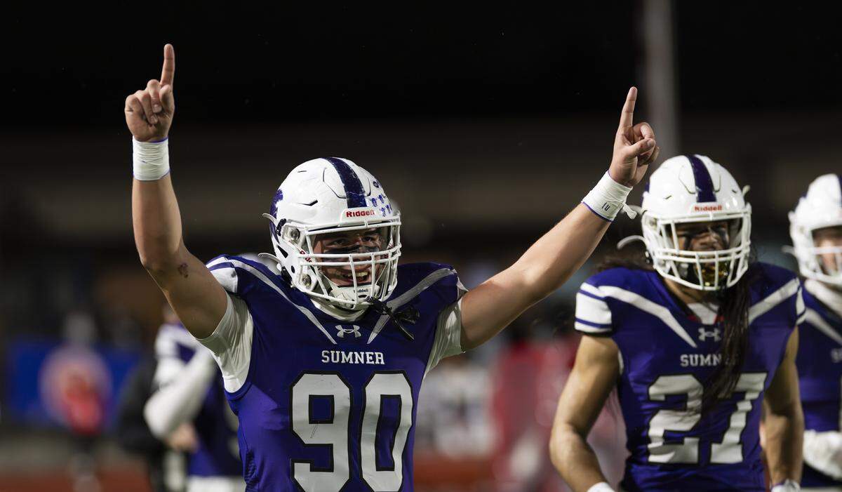 Sumner defensive end Shaun Griffith (90) reacts to a Sumner interception ran back for a touchdown against Eastmont during the first half of the game, at Sunset Chev Stadium on Friday, Nov. 7, 2025, in Sumner, Wash.