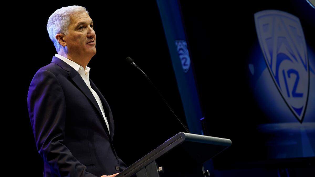 Pac-12 Conference commissioner George Kliavkoff speaks at Pac-12 NCAA college football media day Friday, July 29, 2022, in Los Angeles. (AP Photo/Damian Dovarganes)