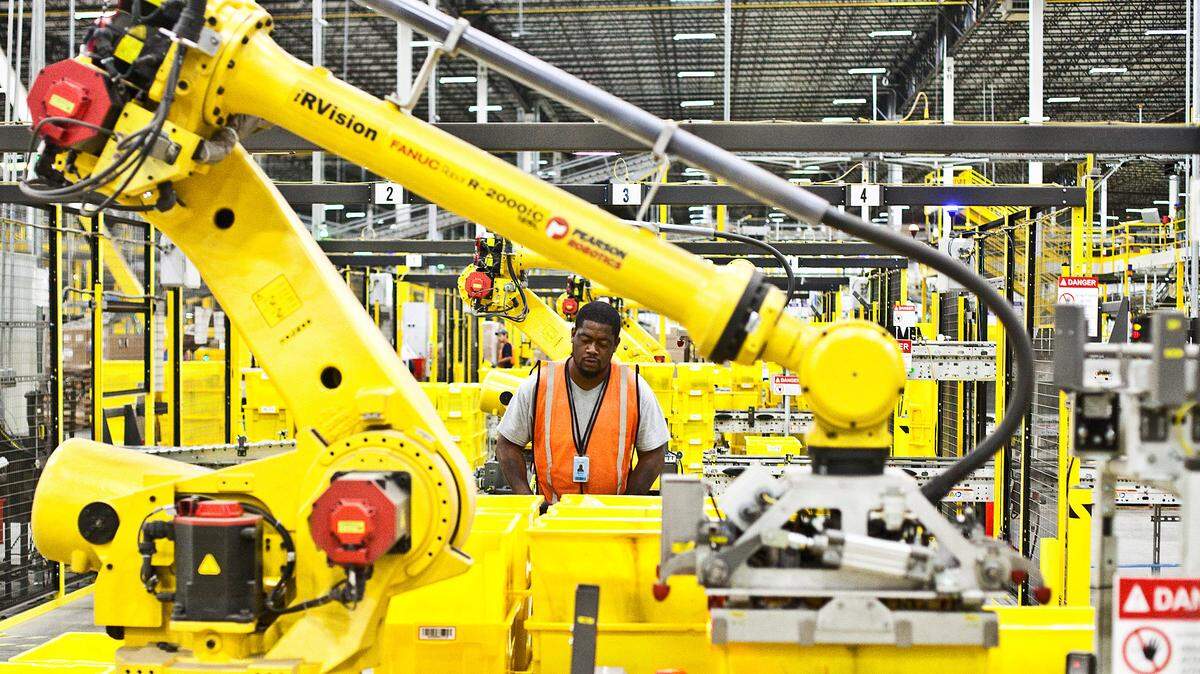 For all the automation and robotics in an Amazon distribution center, it still takes a stunning number of people to staff one - but for how much longer?