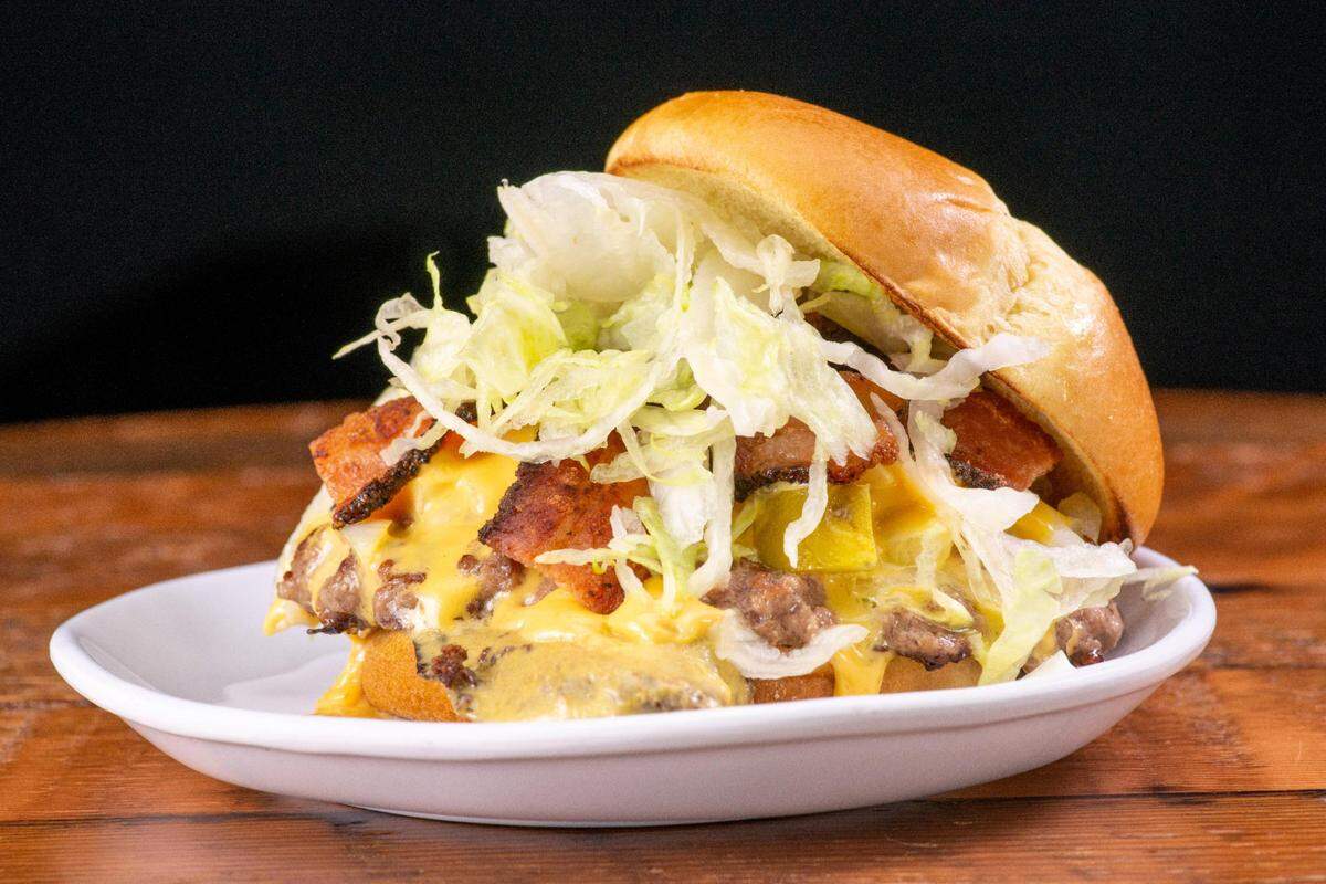 Little Radio will reopen at 728 Pacific Avenue in Tacoma on Dec. 14, 2021, under adjusted ownership. The revamped menu includes a few handhelds, notably smashburgers that build from a single patty and cheese to a deluxe with bacon, onion and pickles.