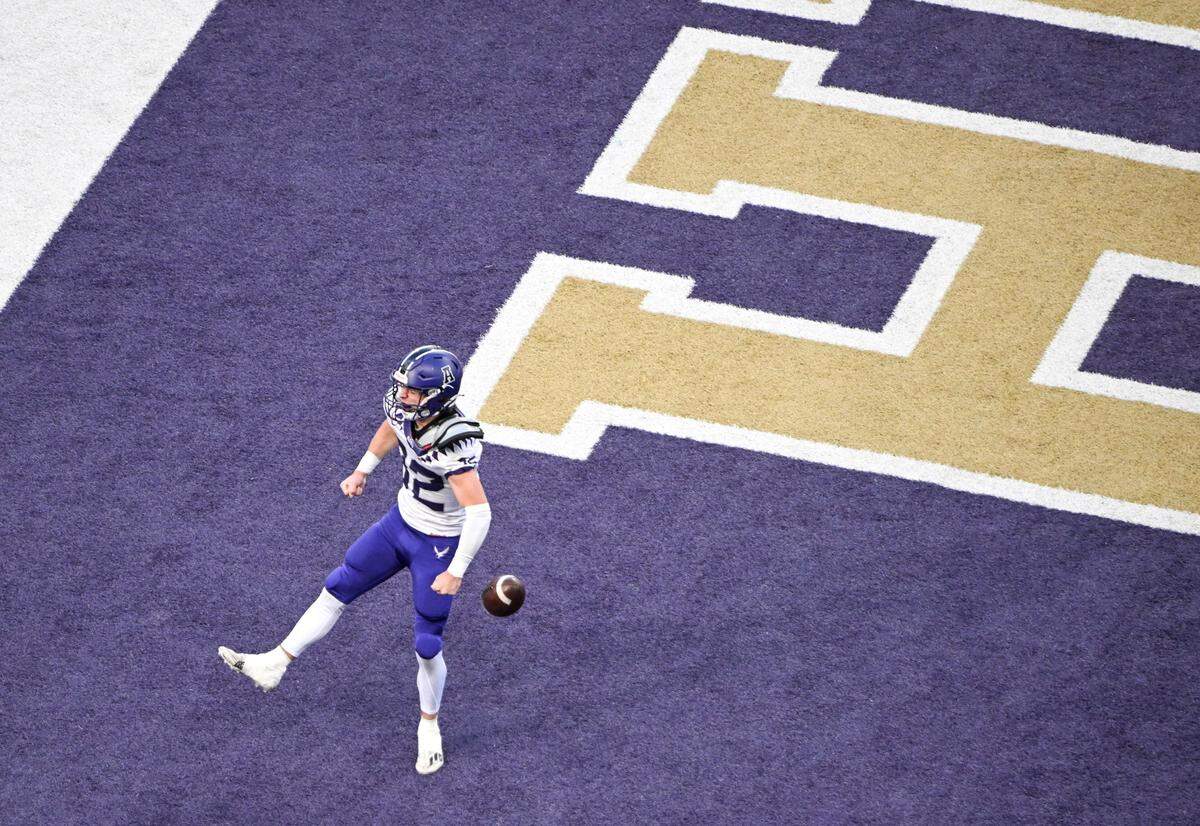 Anacortes’s Brock Beaner (32) celebrates a touchdown during the first half of the 2A state championship game against Tumwater at Husky Field, Saturday, Dec. 2, 2023, in Seattle, Wash.