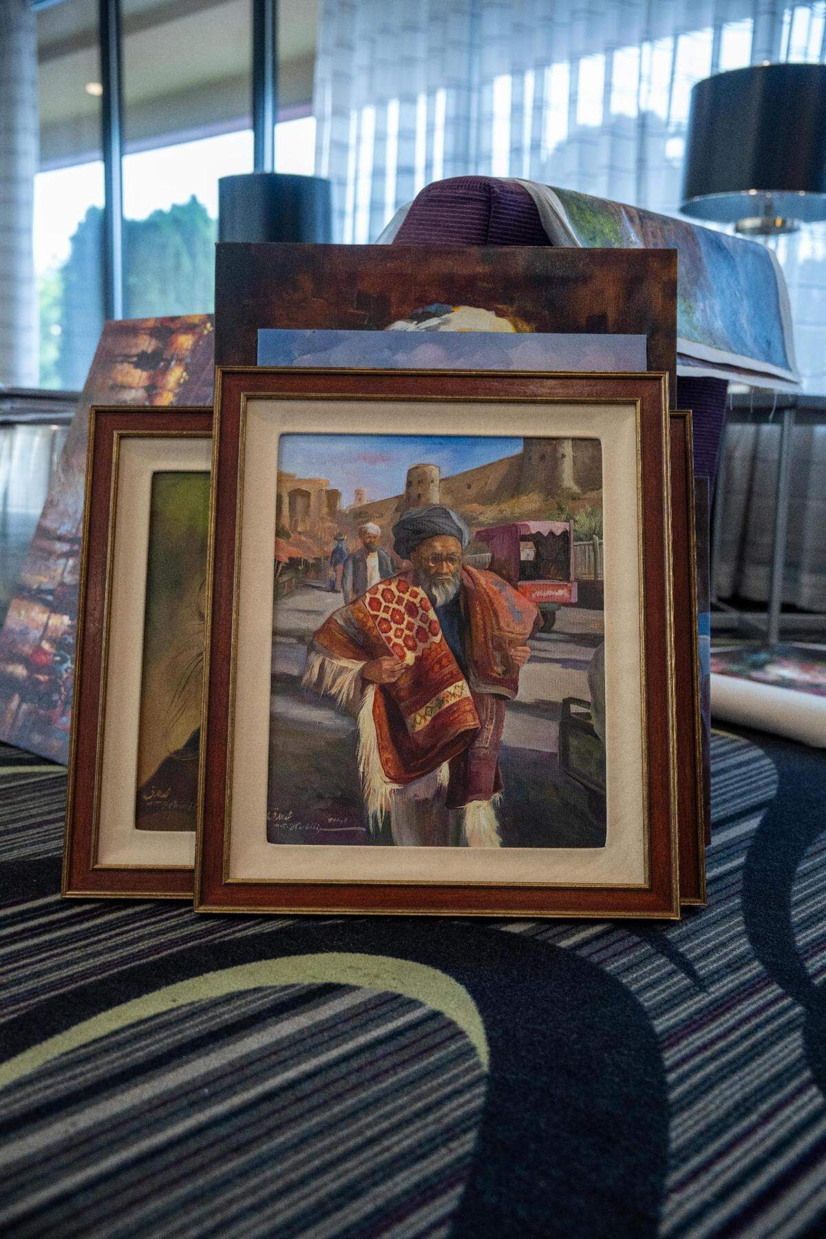 Some of the paintings created by Abdul, an Afghan artist currently trying to work to come to Tacoma with the help of Timothy Ham. Abdul created these paintings based off his experiences and culture in Afghanistan and is selling them to donors in America with the hope of being able to come to Tacoma with his family and teach art.