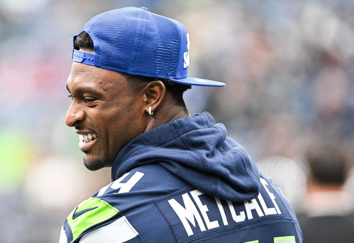 Seattle Seahawks wide receiver DK Metcalf (14) stands on the sidelines before the game against the Arizona Cardinals at Lumen Field, Sunday, Oct. 22, 2023, in Seattle, Wash.
