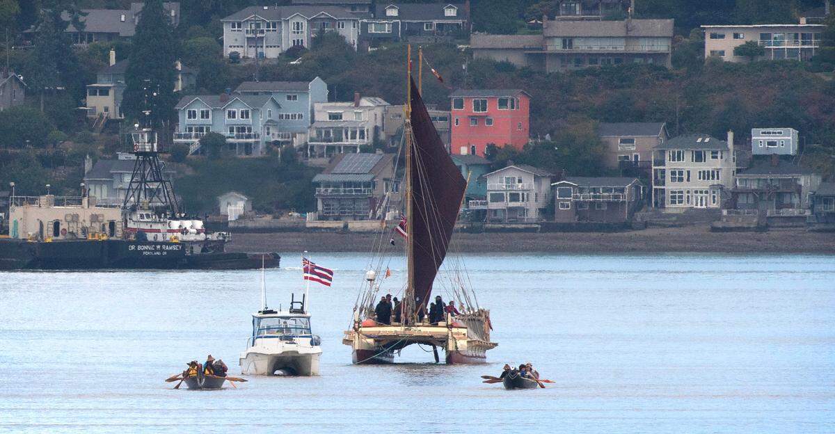 Puyallup Tribe canoes escort the Polynesian voyaging canoe, Hokule’a, upon its arrival at the Thea Ross Waterway in Tacoma, Washington, on Wednesday, Aug. 30, 2023. The canoe and its crew are part of a four-year circumnavigation of the Pacific Ocean that began June 15 in Juneau, Alaska.