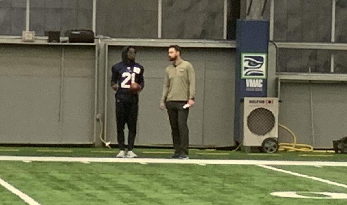 Rookie cornerback Devon Witherspoon watches the start of Seahawks practice Friday, Dec. 22, 2023. The team listed him questionable to play in its Sunday game at the Tennessee Titans because of a hip pointer.