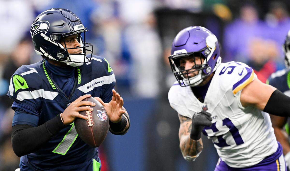 Seattle Seahawks quarterback Geno Smith (7) scrambles under pressure Minnesota Vikings linebacker Blake Cashman (51) during the third quarter of the game at Lumen Field, on Sunday, Dec. 22, 2024, in Seattle, Wash.