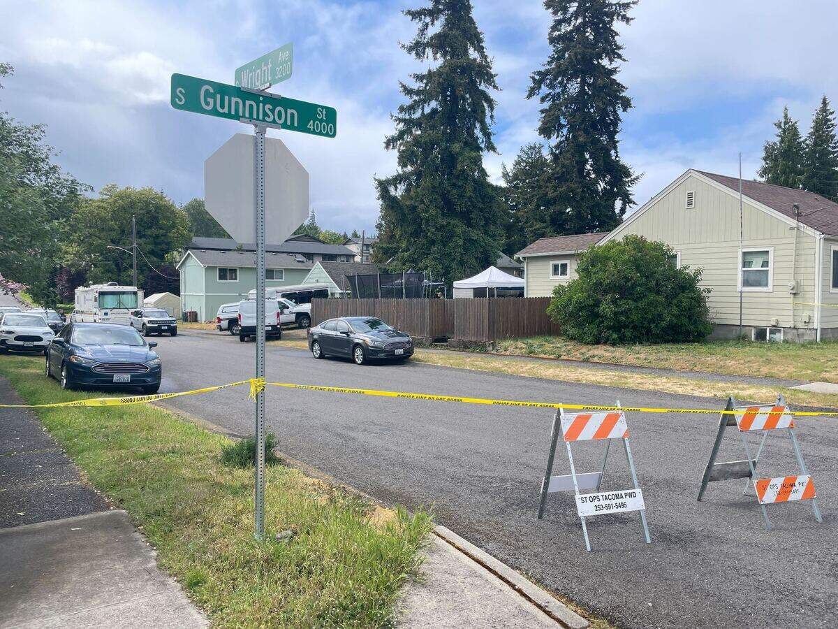 Investigators were at a Tacoma house on Monday searching for evidence in a cold case. Police released few details.