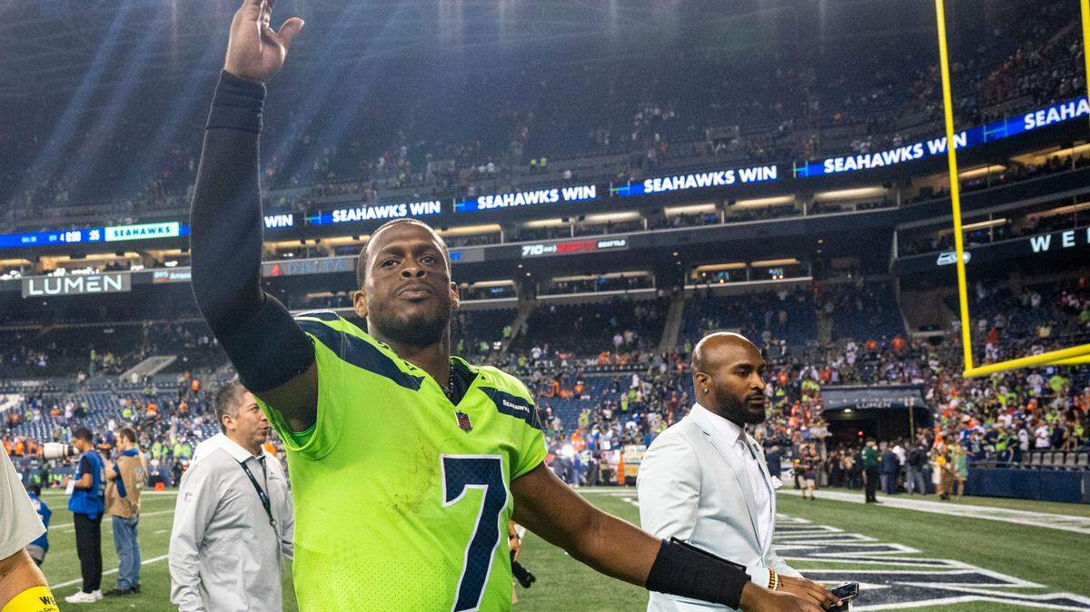 Seahawks quarterback Geno Smith (7) responds to the crowds chants of “Geno, Geno, Geno” as he walks off the field after Seattle beat Denver, 17-16, in an NFL game on Monday, Sept. 12, 2022, at Lumen Field in Seattle.