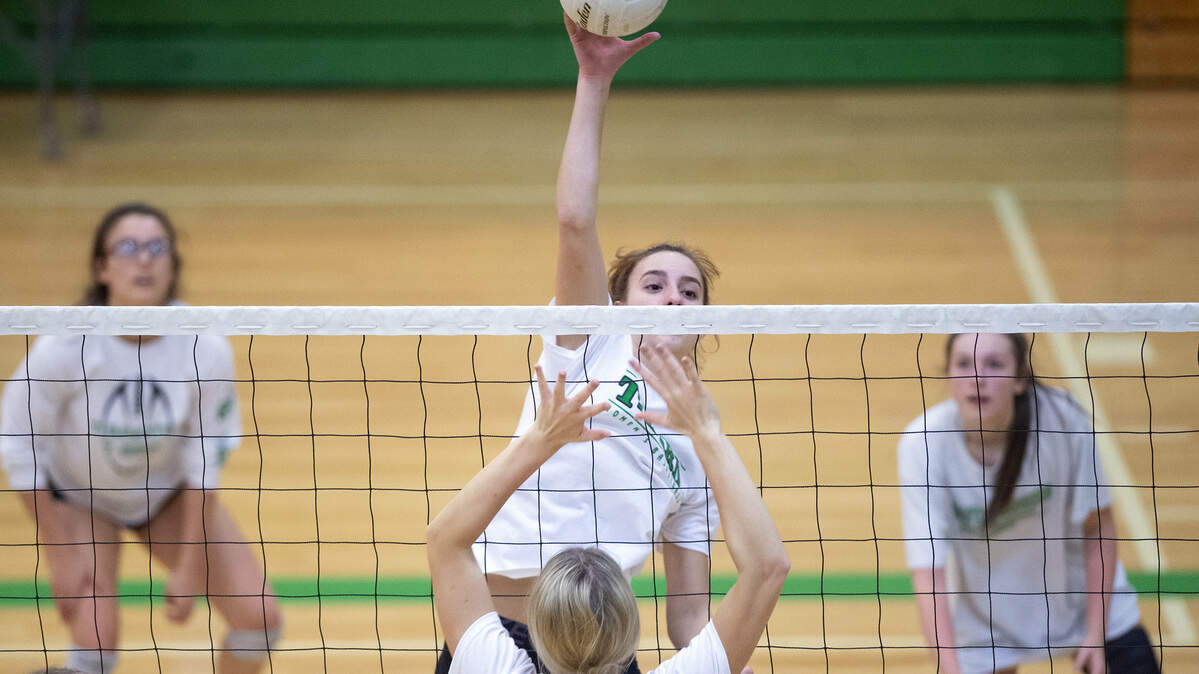 Tumwater sophomore Natalie Sumrok tips a shot over the net during volleyball practice at Tumwater High School on Wednesday, Nov. 13, 2019.