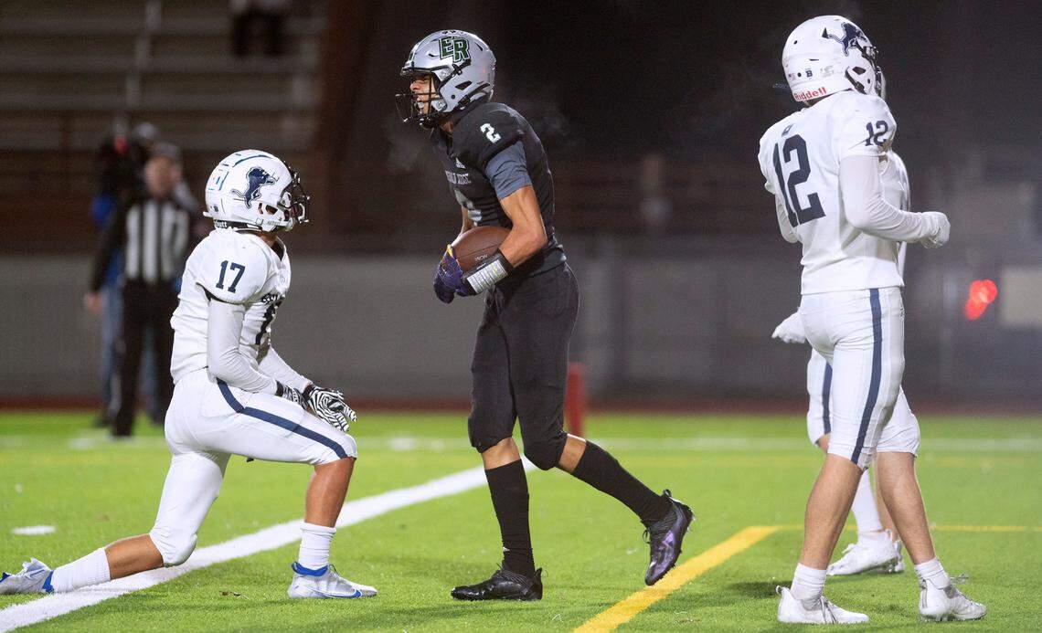 Emerald Ridge wide receiver Denzel Boston lets out a roar after scoring a touchdown in front of Bellarmine Prep defenders Alex Quintanilla (17) and Caleb Strombeck during Thursday night’s 4A SPSL football game at Sparks Stadium in Puyallup, Washington, on Sept. 30, 2021.