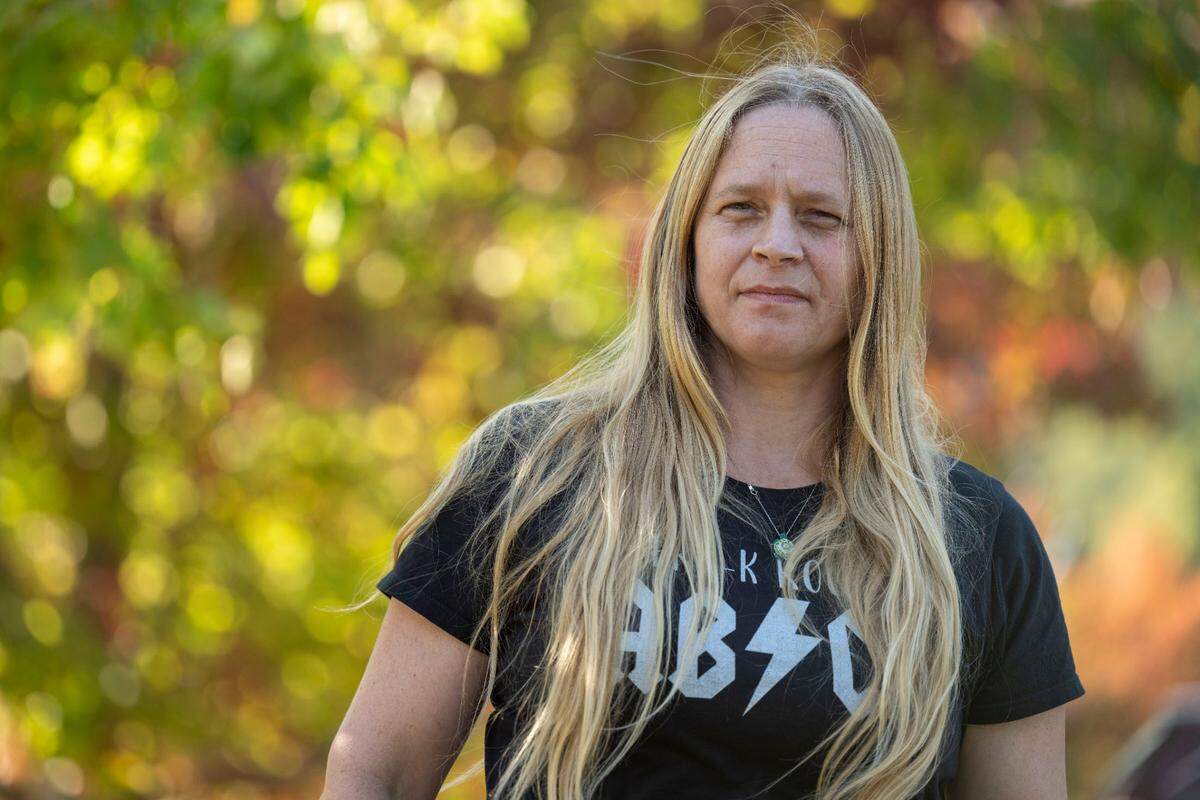 Ella Christiansen, a former teacher at Rainy Dayz Preschool, poses for a portrait at Sehmel Park in Gig Harbor, Wash., on Wednesday, Oct. 12, 2022. Christiansen said that when the school was in between stable locations it they would hold class in the park.