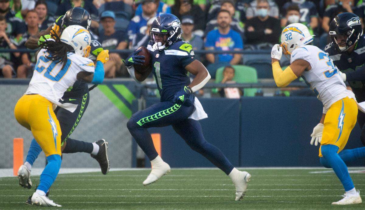 Seattle wide receiver Dee Eskridge runs a sweep during Saturday night’s NFL preseason football game against the Los Angeles Chargers at Lumen Field in Seattle, Washington, on Aug. 28, 2021.