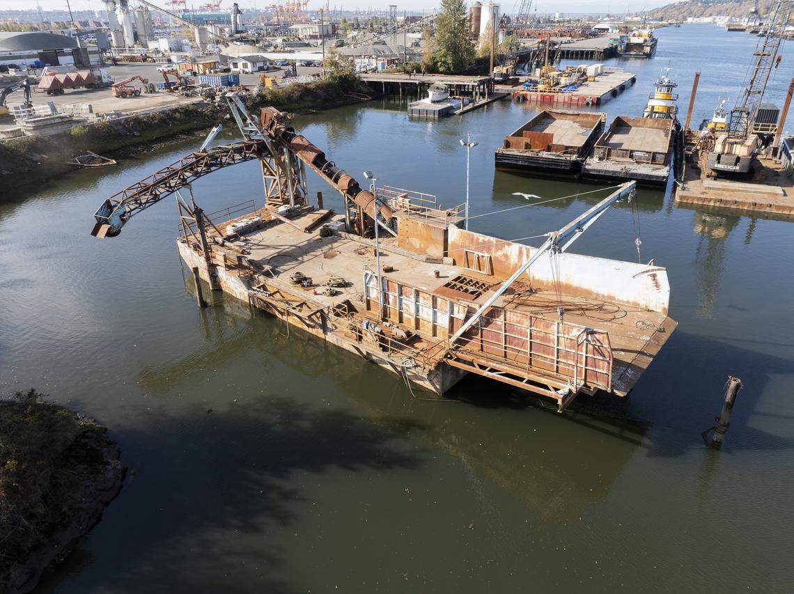 The Disawah sits derelict in the Hylebos Waterway in the Port of Tacoma on Tuesday, Oct. 21, 2025, in Tacoma. The abandoned vessel is being removed after efforts to have its owner move it were unsuccessful.
