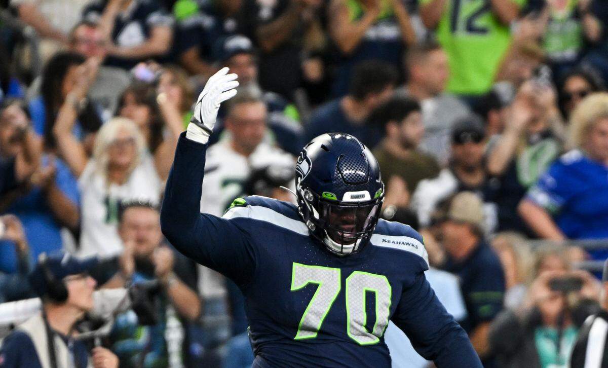 Seattle Seahawks guard Anthony Bradford (70) reacts to a touchdown against the Dallas Cowboys during the second quarter of the preseason game at Lumen Field, Saturday, Aug. 19, 2023, in Seattle, Wash.