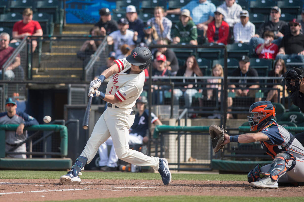 Tacoma Rainiers second baseman Sam Haggerty swings at a pitch in a game against the Sugar Land Space Cowboys on Sunday, April 24, 2022 at Cheney Stadium in Tacoma, Wash.