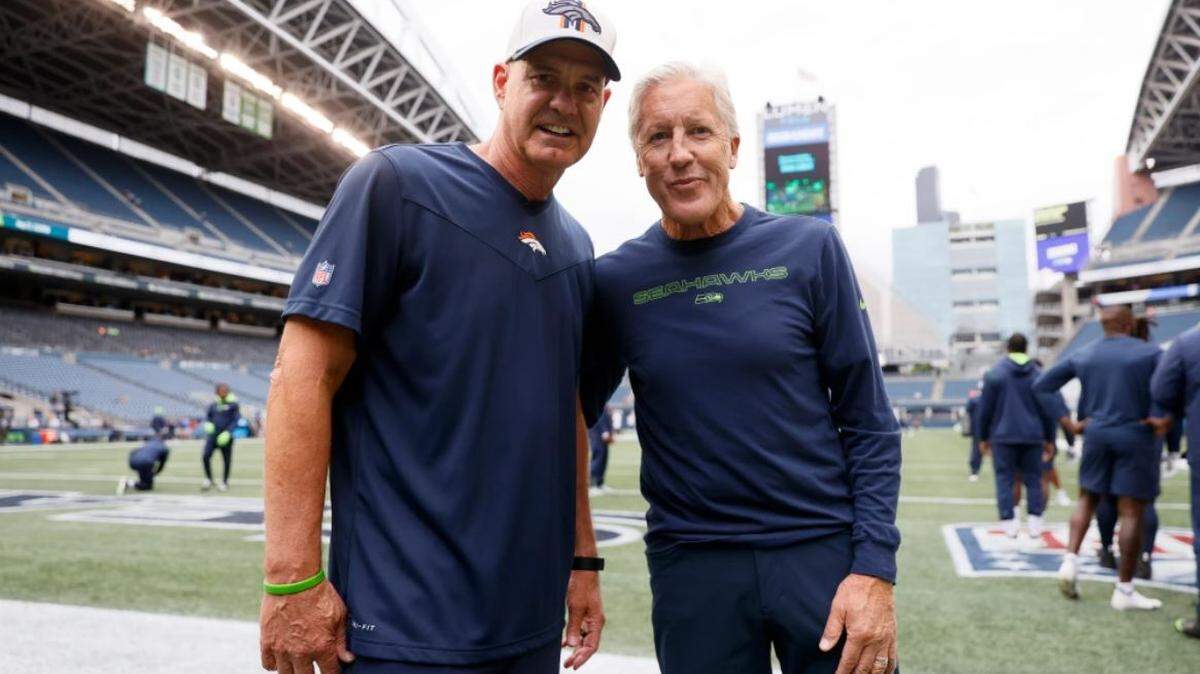 Denver Broncos defensive coordinator Ed Donatell, left, and Seahawks coach Pete Carroll first coached together at the University of the Pacific in 1983. The Seahawks have reportedly asked the Broncos for permission to interview Donatell for Seattle’s vacant defensive-coordinator position. Carroll fired Ken Norton Jr. from that job Tuesday.