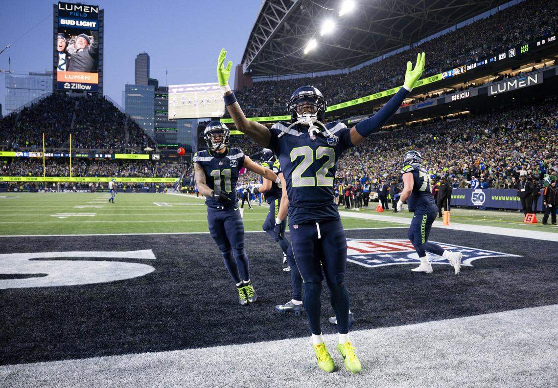 Seattle Seahawks wide receiver Jaxon Smith-Njigba (11) AND wide receiver Rashid Shaheed (22) react to Jaxon Smith-Njigba touchdown during the second quarter of the NFC Championship game against the Los Angeles Rams at Lumen Field, on Sunday, Jan. 25, 2026, in Seattle.