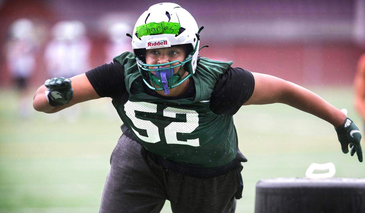 Peninsula defensive lineman Royal Charles runs through plays during preseason football practice at Peninsula High School in Purdy, Washington, on Friday, Aug. 23, 2024.