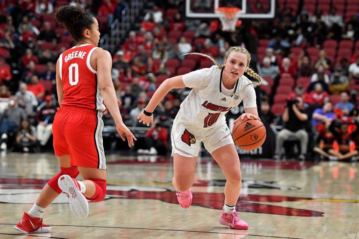 Former Louisville guard Hailey Van Lith (10) drives past Ohio State guard Madison Greene (0) during the second half of an NCAA college basketball game in Louisville, Ky., Wednesday, Nov. 30, 2022. Ohio State won 96-77. (AP Photo/Timothy D. Easley)