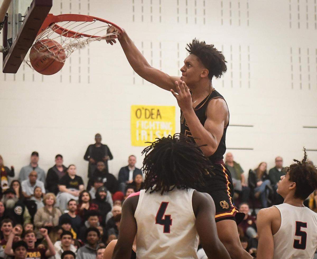 O’Dea’s Paolo Banchero throws down a dunk during the third quarter. Wilson played O’Dea in a basketball game at Mount Tahoma high school in Tacoma, Wash., on Friday, Feb. 28, 2020.