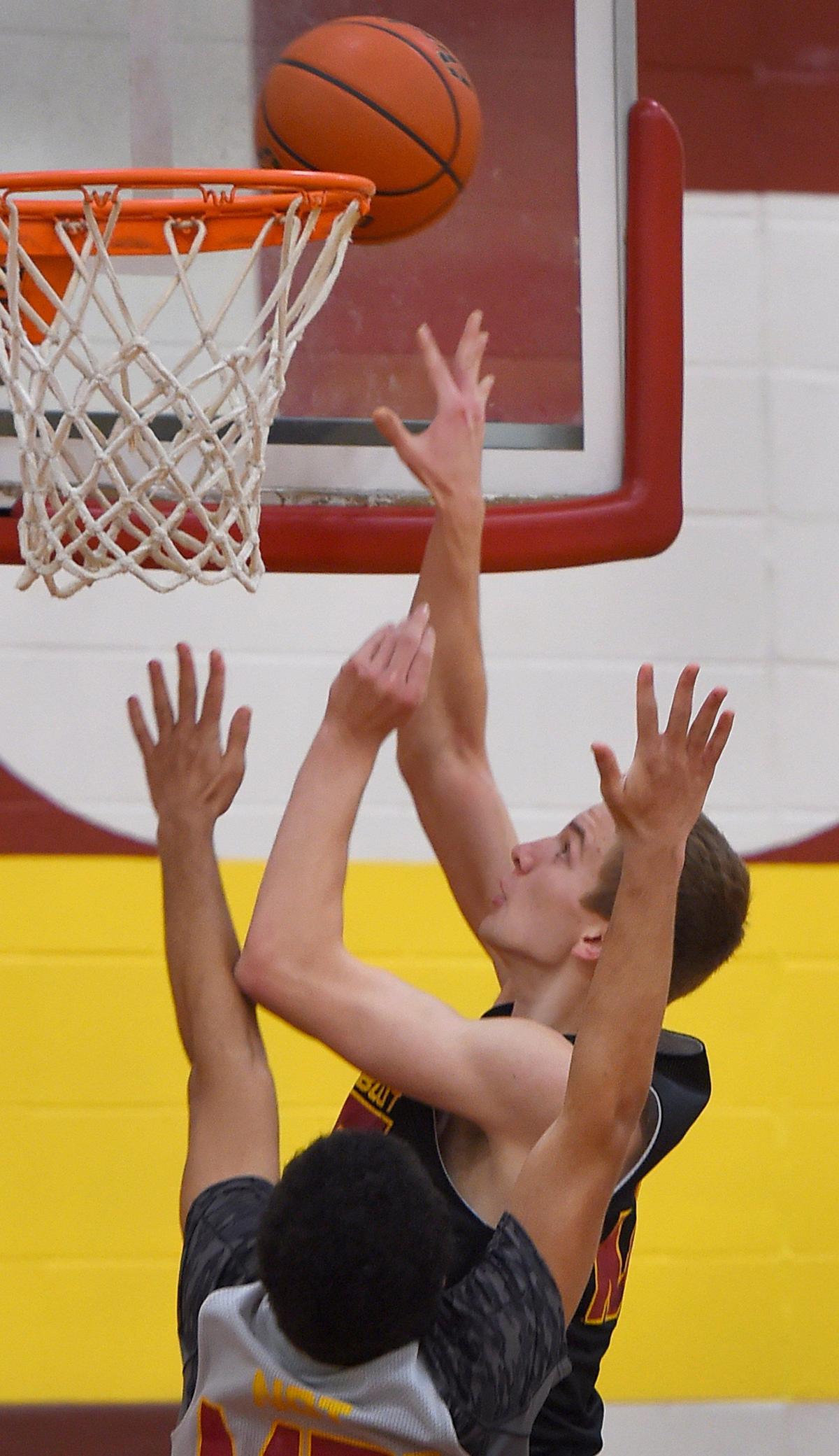 Cougar forward Brandin Riedel powers to the hoop during Capital’s Dec. 30th practice.