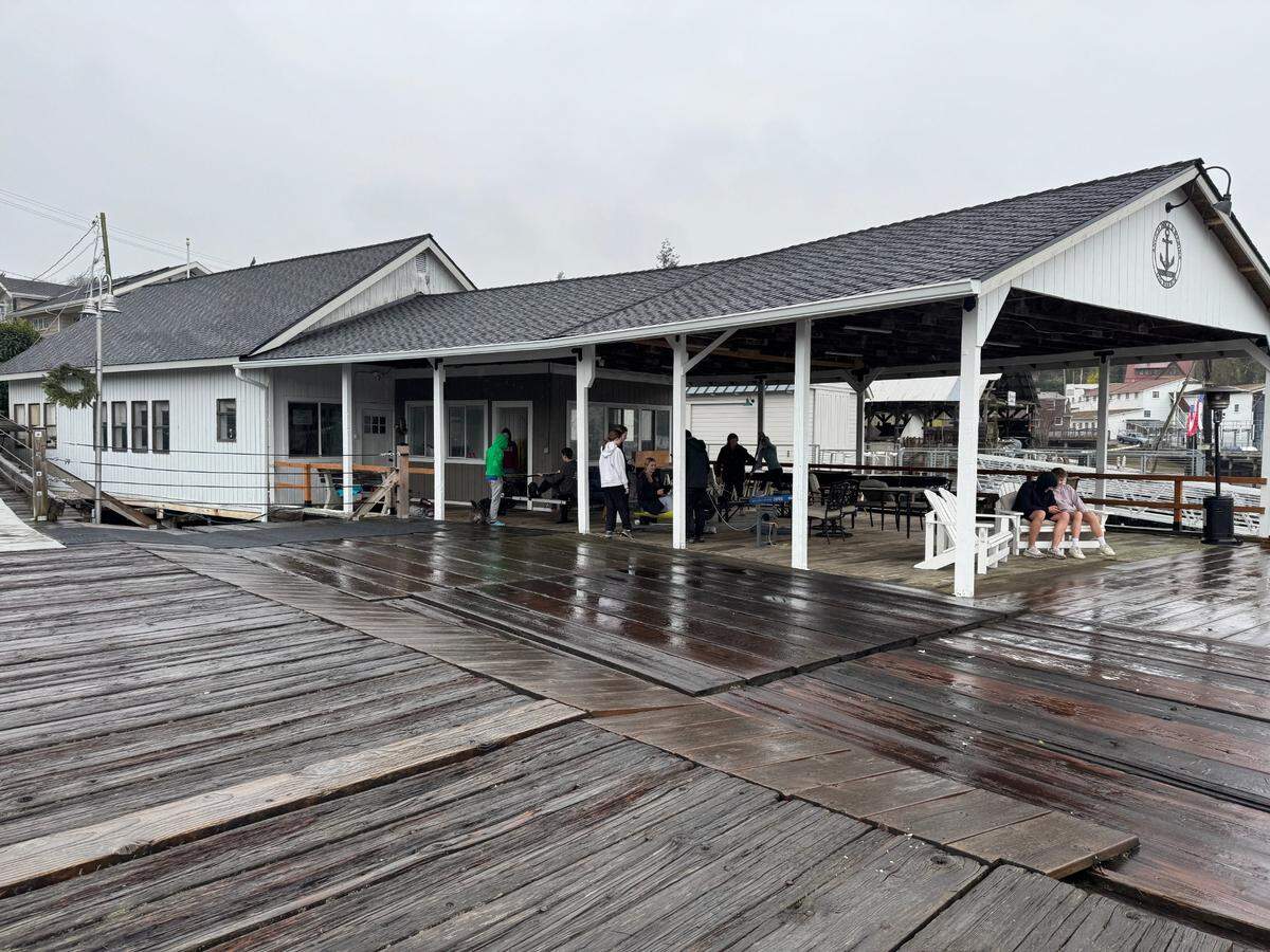 Members of the Gig Harbor Canoe & Kayak Racing Team at the Ancich Dock netshed, which the team rents as a clubhouse at a discount from owner John Lee, in Gig Harbor, Wash. on Saturday, Feb. 8, 2025