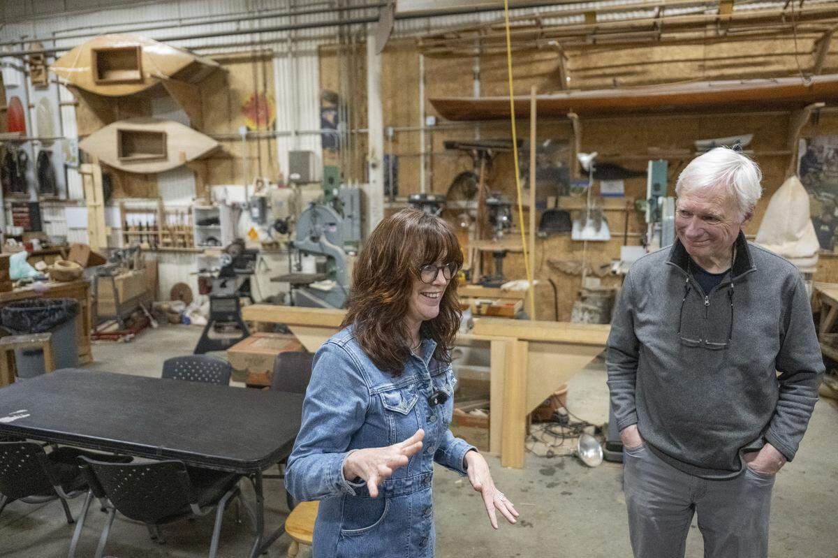 Shannon Shea, left, executive director of Tacoma Boat Builders, and Paul Birkey, the founder of Tacoma Boat Builders, give a tour of the organization's facilities on Friday, April 24, 2026, in Tacoma, Wash.