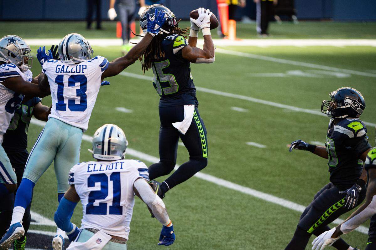 Seattle Seahawks Ryan Neal makes an interception in the end zone to seal the game. The Seattle Seahawks played the Dallas Cowboys in a NFL football game at CenturyLink Field in Seattle, Wash., on Sunday, Sept. 27, 2020.