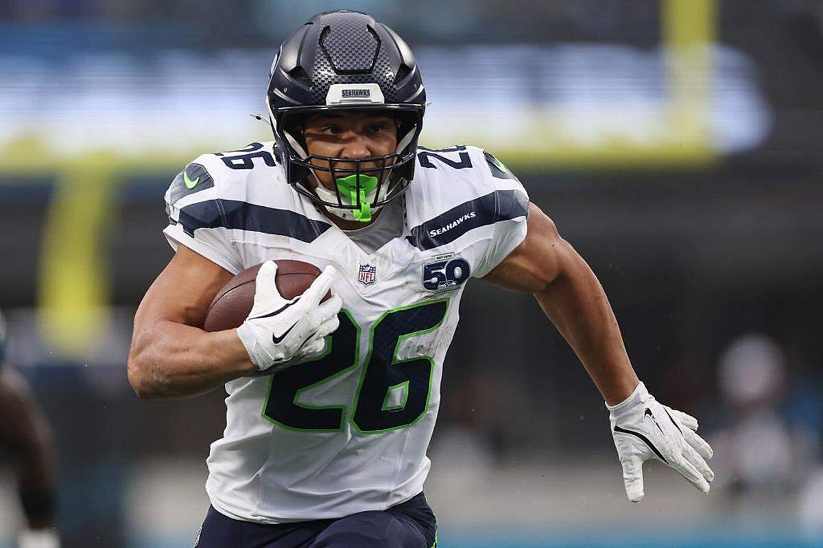 CHARLOTTE, NORTH CAROLINA - DECEMBER 28: Zach Charbonnet #26 of the Seattle Seahawks runs with the ball during the third quarter against the Carolina Panthers at Bank of America Stadium on December 28, 2025 in Charlotte, North Carolina. (Photo by David Jensen/Getty Images)