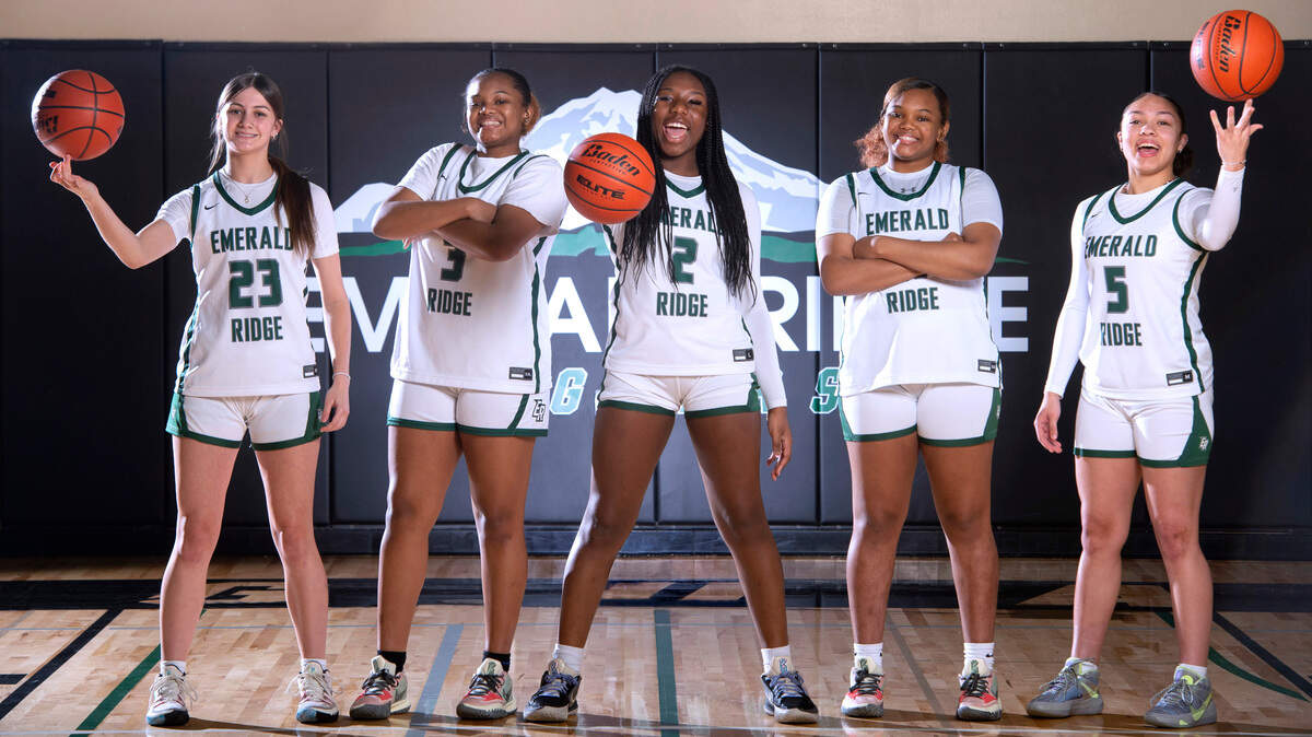 Emerald Ridge starting five (from left) Alina Sapilak, Maya Barnett, Kali Haizlip, Marecia Barnett and Monique Carter have lead the Jaguars to an undefeated record atop the 4A South Puget Sound League. They are shown before practice at Emerald Ridge High School in Puyallup, Washington, on Friday, Jan. 21, 2022.