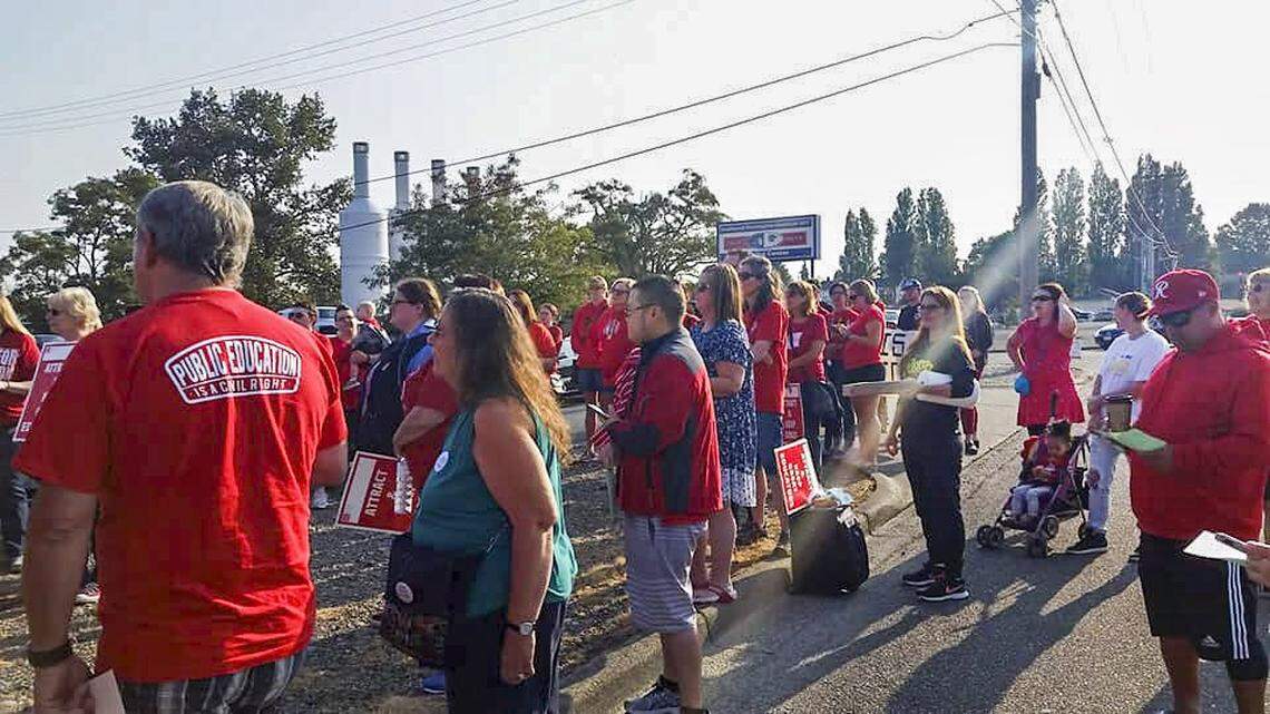 Tacoma teachers rally to support their bargaining team outside the Tacoma Education Association’s union office building on Aug. 28.
