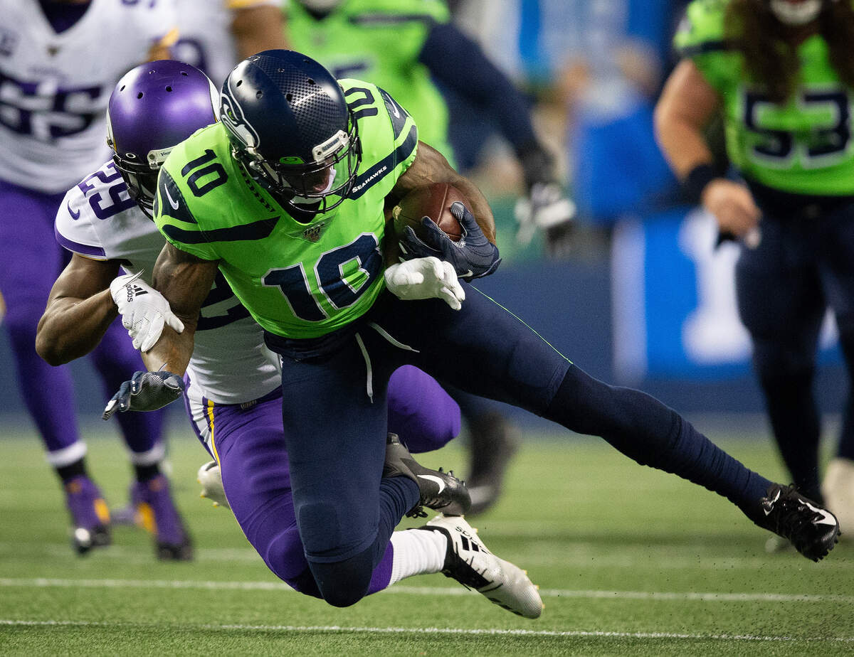Minnesota Vikings cornerback Xavier Rhodes (29) tackles Seattle Seahawks wide receiver Josh Gordon (10) during the first quarter. The Seattle Seahawks played the Minnesota Vikings in a NFL football game at CenturyLink Field in Seattle, Wash., on Monday, Dec. 2, 2019.