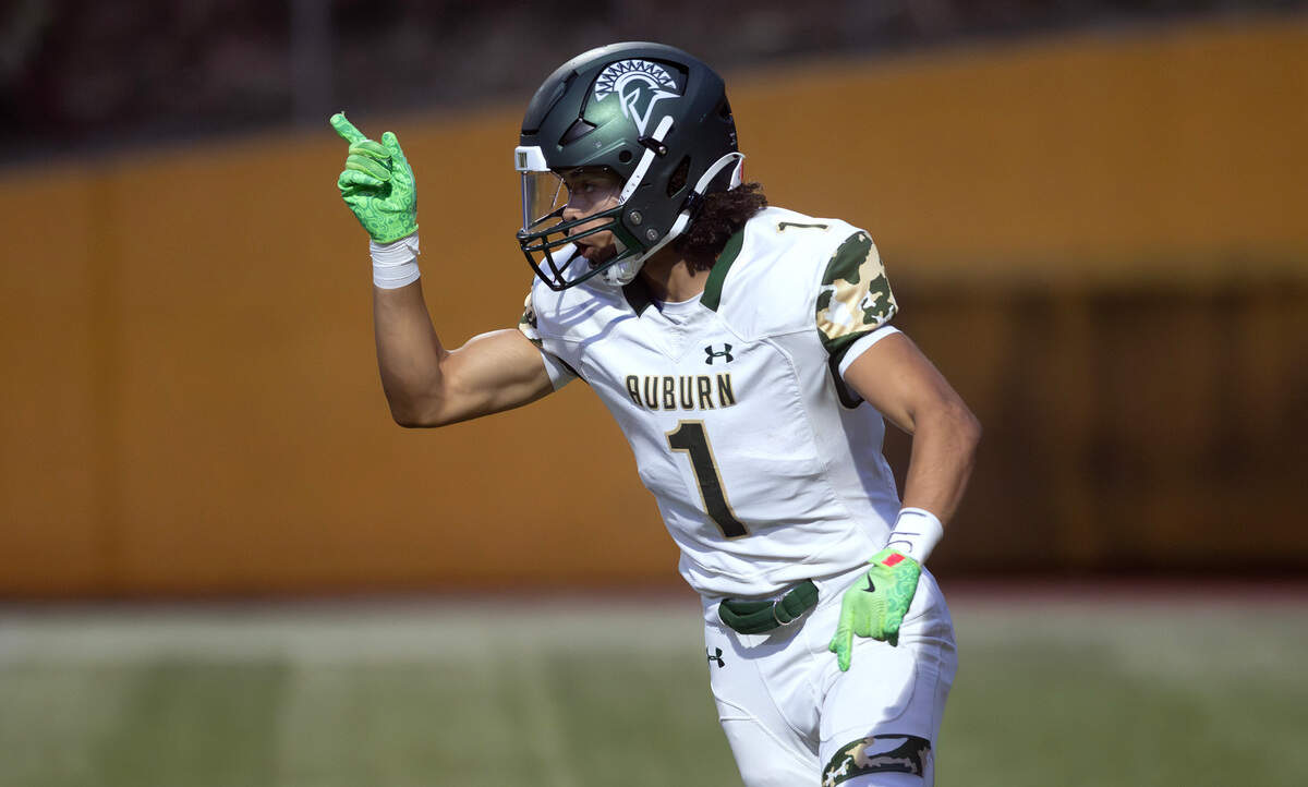 Auburn wide receiver Lucas Whitehall-Gilke celebrates the Trojans’ opening touchdown during Thursday night’s North Puget Sound League football game against the Stadium Tigers at Stadium High School in Tacoma on Sept. 24, 2024.