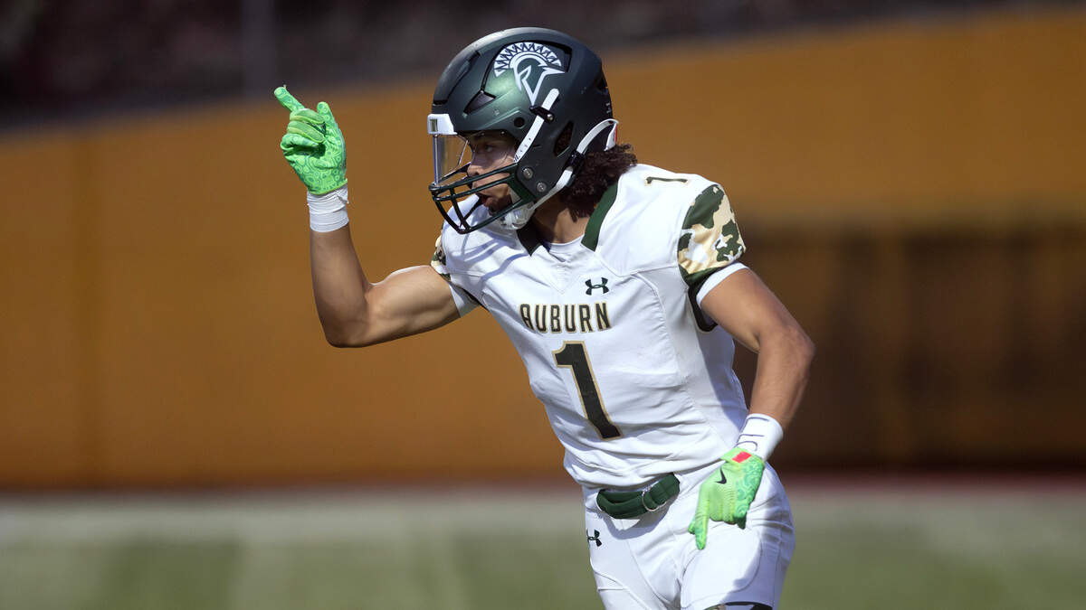 Auburn wide receiver Lucas Whitehall-Gilke celebrates the Trojans’ opening touchdown during Thursday night’s North Puget Sound League football game against the Stadium Tigers at Stadium High School in Tacoma, Washington, on Sept. 24, 2024.