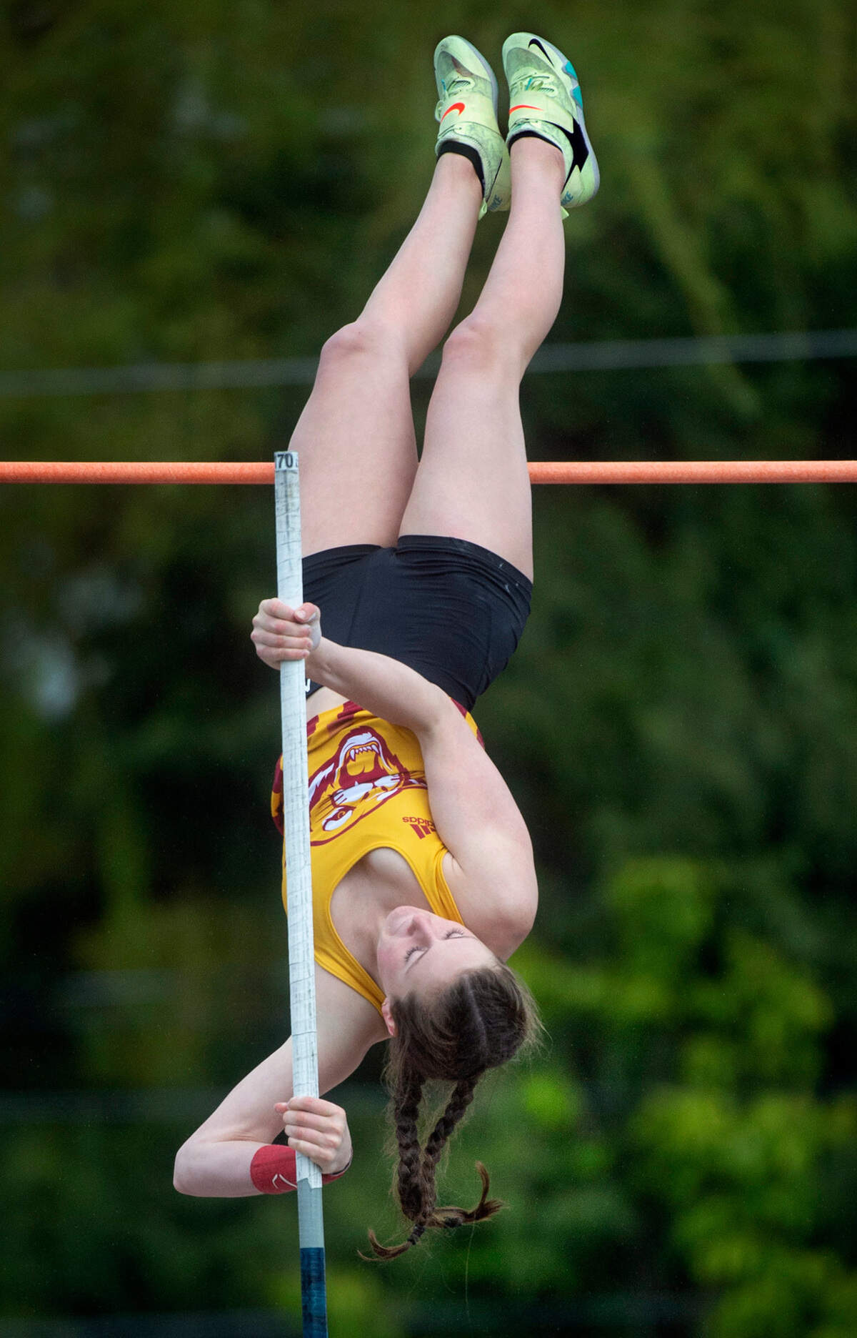Capital High junior Amanda Moll goes vertical during the South Sound Track Classic pole vault competition at Sparks Stadium in Puyallup, Washington, on Saturday, April 16, 2022.