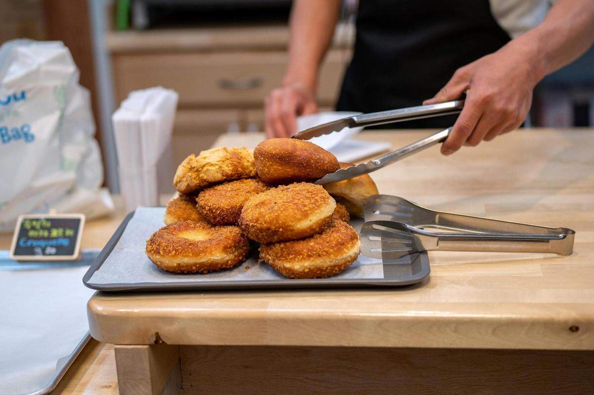 Bon Bon specializes in Asian treats, especially chapssal, a Korean sweet rice doughnut. On May 26, 2022, a customer selected a few of the house karaage doughnuts rolled in panko and one soboro, a sweet bread with a streusel shell.