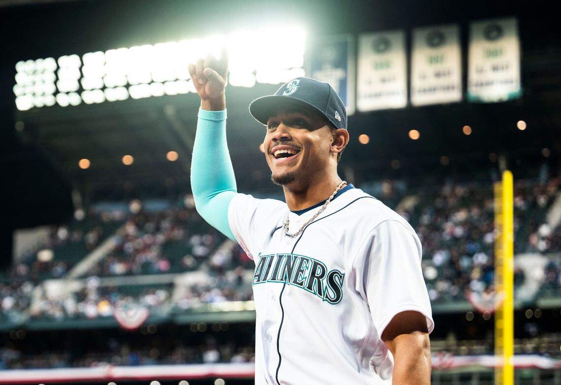 Seattle Mariners center fielder Julio Rodriguez (44) walks onto the field to accept the Silver Slugger and AL Rookie of the Year awards during the opening ceremony before the start of the Mariners home opener against the Cleveland Guardians at T-Mobile Park in Seattle on Thursday, March 30, 2023.