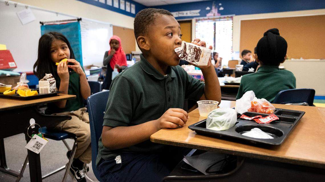 Evergreen Elementary first-grader James Thomas eats lunch at his desk in his classroom at the school in Spanaway last June. The Office of the Superintendent of Public Instruction is introducing legislation this year to provide free school meals for all K-12 students in Washington.