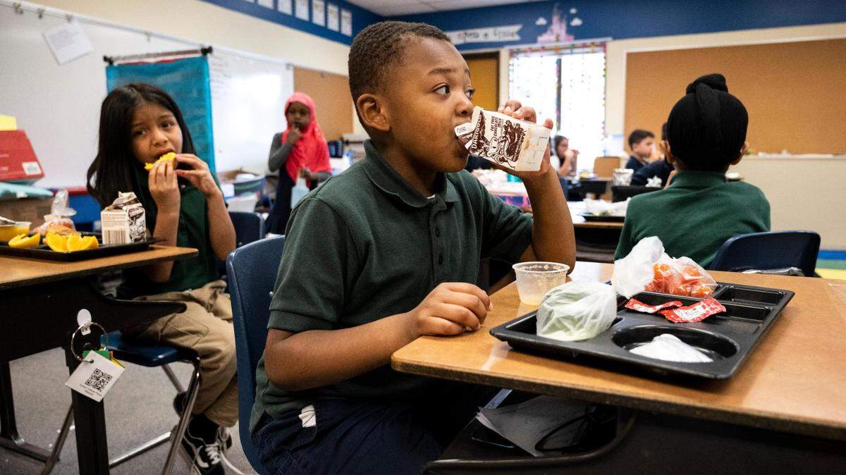 Evergreen Elementary first-grader James Thomas eats lunch at his desk in his classroom at the school in Spanaway last June. The Office of the Superintendent of Public Instruction is introducing legislation this year to provide free school meals for all K-12 students in Washington.