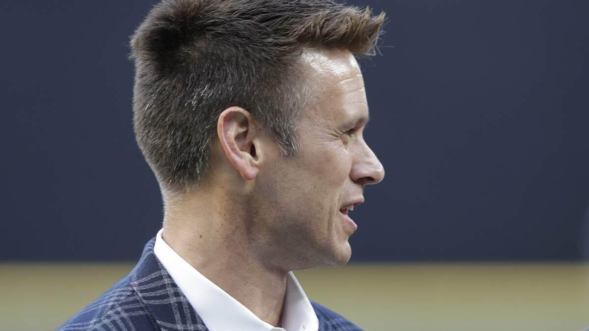 Seattle Mariners general manager Jerry Dipoto stands on the field before a baseball game against the Toronto Blue Jays, Friday, Aug. 3, 2018, in Seattle. (AP Photo/Ted S. Warren)