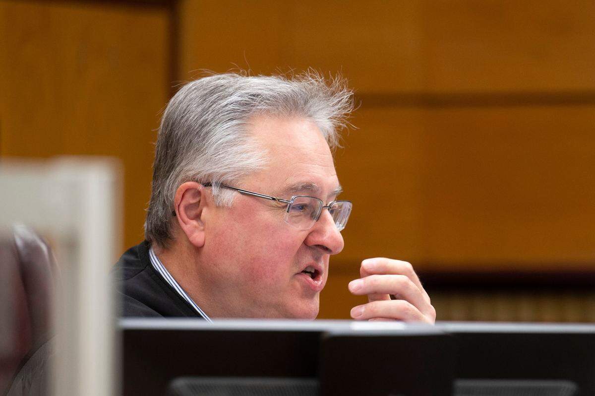 Pierce County Superior Court Judge Bryan Chushcoff deliberates whether to move the date of the trial for the Tacoma police officers charged with killing Manny Ellis. Photographed during a hearing on Friday, Dec. 2, 2022, at Pierce County Superior Court in Tacoma.