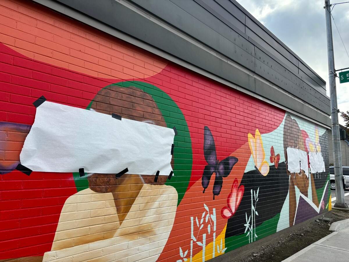 A mural painted outside the South Branch of the Tacoma Public Library was defaced with racist slurs and white-supremacist imagery.