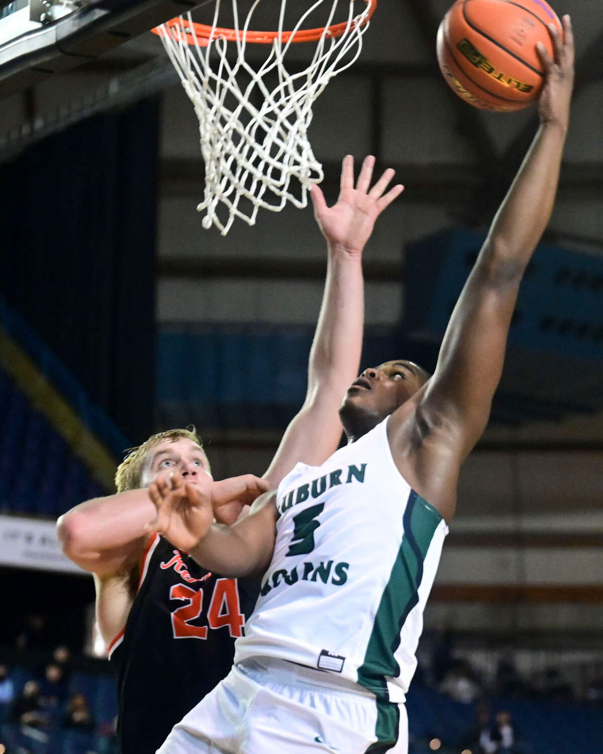 Auburn guard Luvens Valcin (5) attempts a shot as Kennewick forward Ayden Knapik (24) defends during the third quarter of a Class 3A state tournament game on Wednesday, March 2, 2022, at the Tacoma Dome, in Tacoma, Wash.