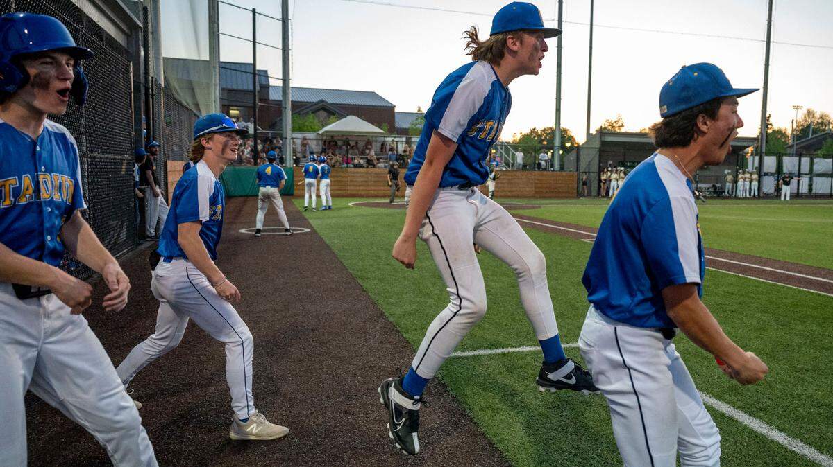 The Stadium dugout celebrates after scoring a run in the top of the seventh inning of the 3A West Central/Southwest district baseball championship game against Timberline at Auburn High School on Saturday, May 13, 2023, in Auburn, Wash.