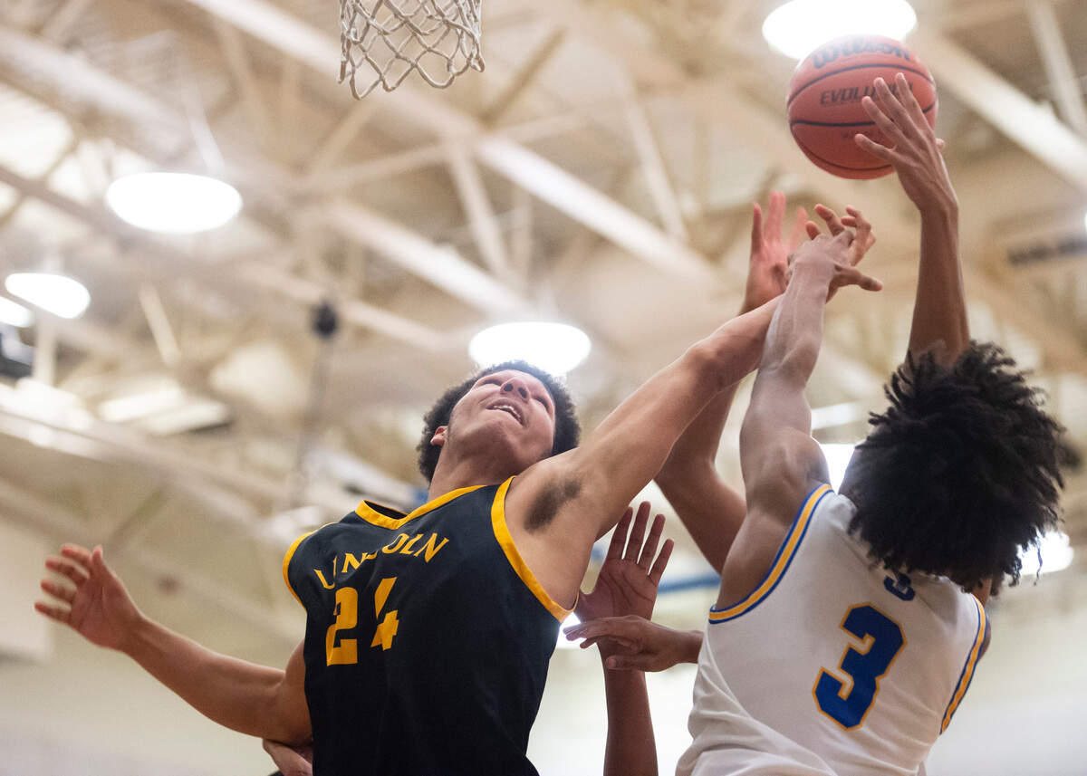 Lincoln’s forward Omarion Boston (24) tries to rebound the ball against Stadium’s guard Donovan Gill (3) during a game at Stadium High School in Tacoma, Wash. on Jan. 18, 2023. Stadium defeated Lincoln 65-54.