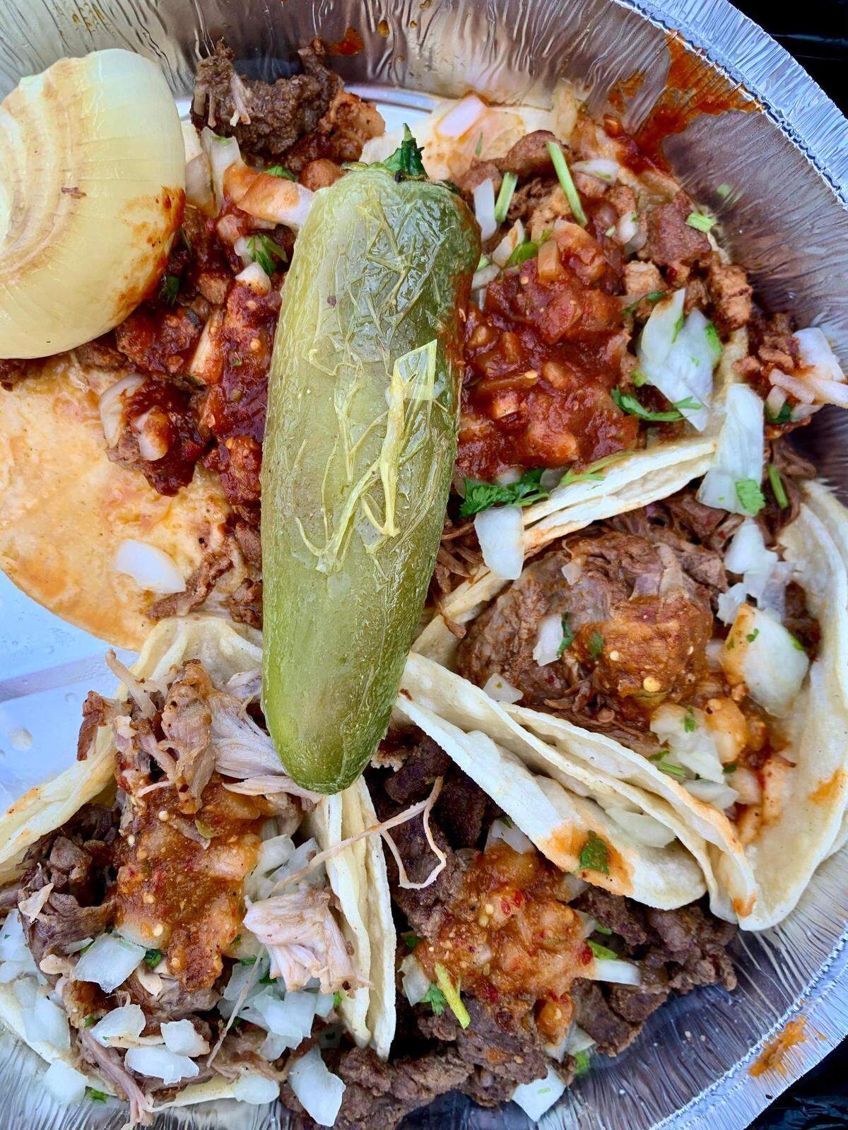 A sampling of tacos at El Antojo in Tacoma, on the edge of the Lincoln District and McKinley. If someone in your house wants a burger, grab one under the same roof at the Burger Broiler.