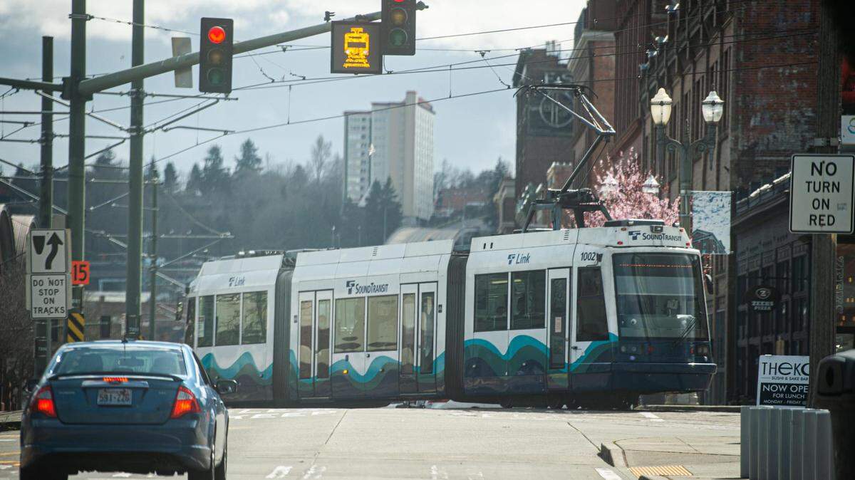 The Tacoma Link Light Rail passes onto Pacific Avenue in Tacoma on Monday, March 22, 2021.