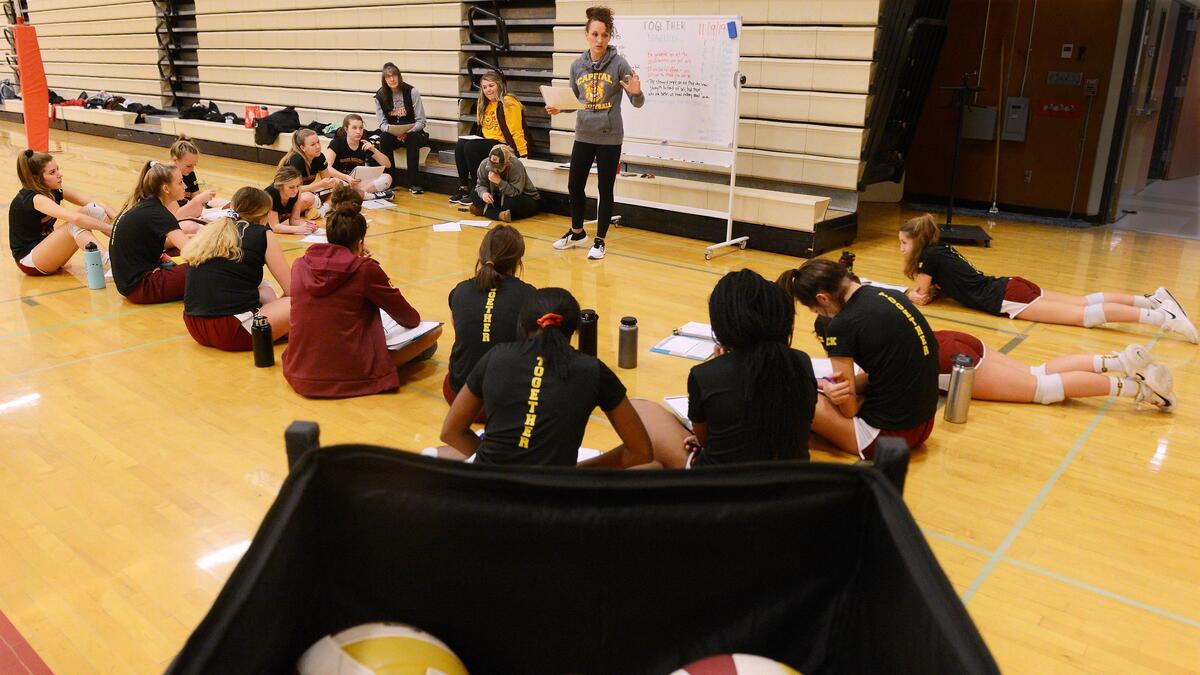 Capital head coach Katie Turcotte hold her regular team meeting at the start of the Cougars’ Nov. 19th practice.