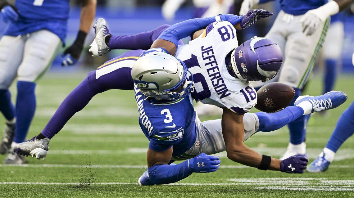 Seattle Seahawks safety Nick Emmanwori (3) slams Minnesota Vikings wide receiver Justin Jefferson (18) during the third quarter of the game at Lumen Field, on Sunday, Nov. 30, 2025, in Seattle. It was ruled unnecessary roughness.