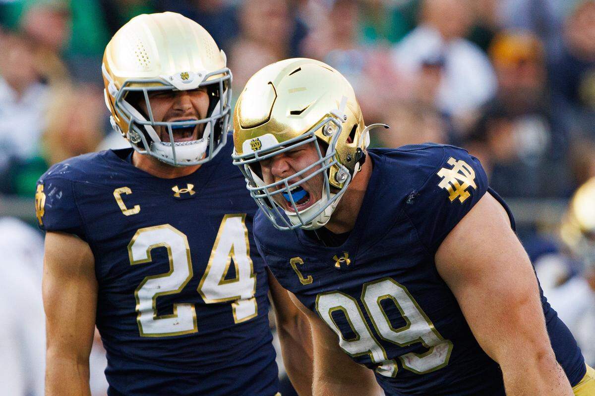 Notre Dame defensive lineman Rylie Mills (99) and linebacker Jack Kiser (24) celebrate a sack by Mills during a NCAA college football game between Notre Dame and Stanford at Notre Dame Stadium on Saturday, Oct. 12, 2024, in South Bend.